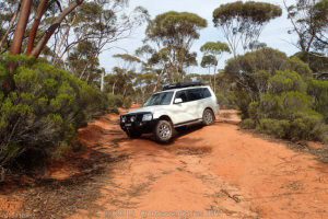 Lifting a wheel on the Pajero on the Old Hyden Norseman Road