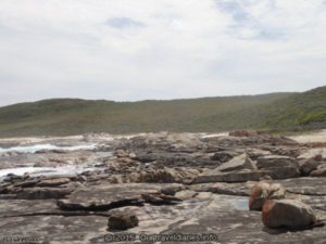 Little rock pools form on the rocky shore - Fanny Cove