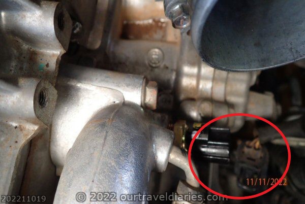 Unclip the engine coolant temperature sensor wires